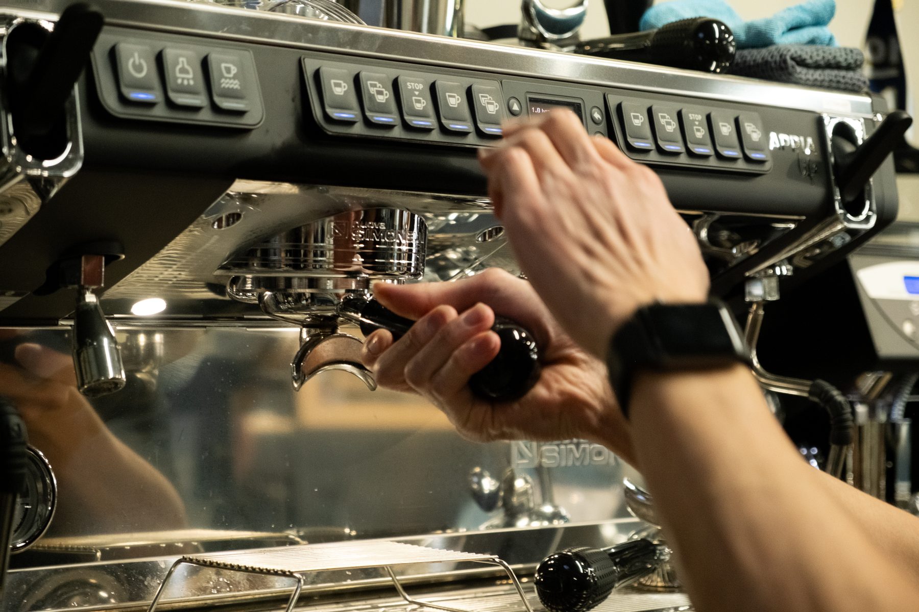 Barista hands finishing a drink